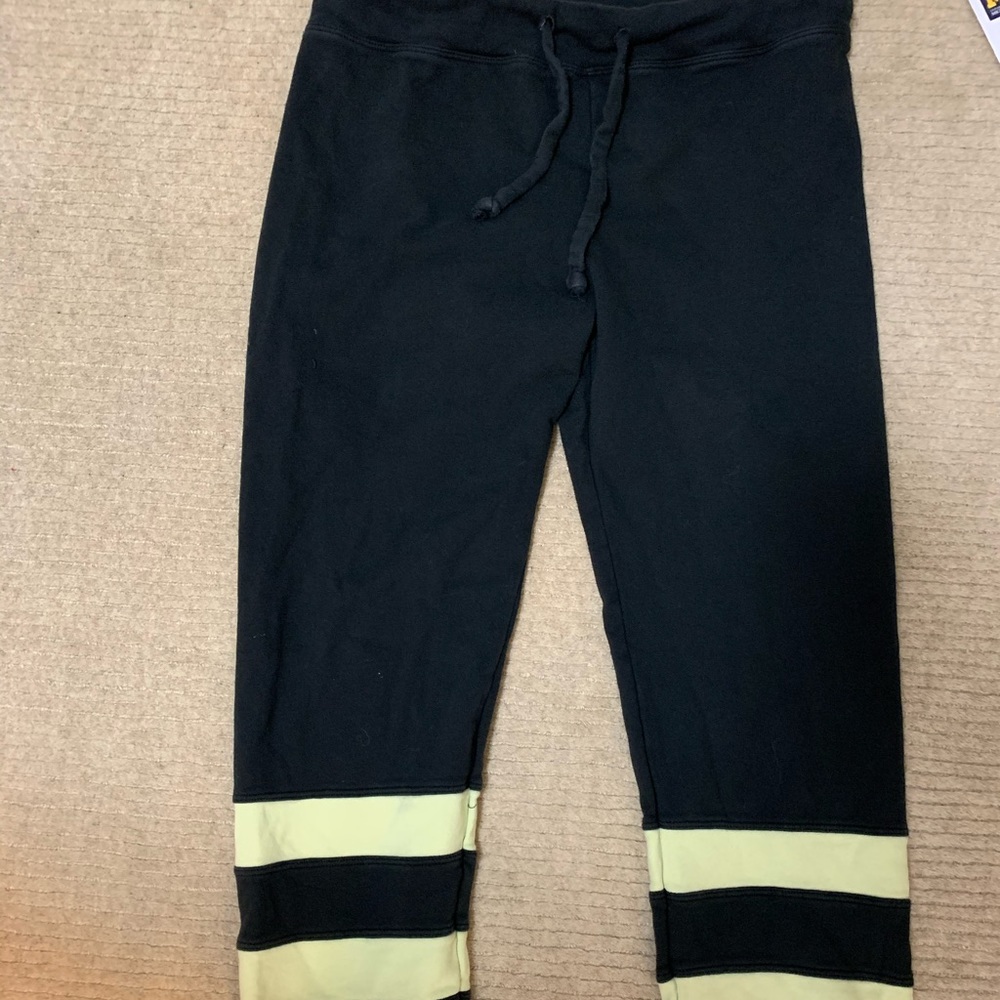 BLACK “YEAR OF OURS” JOGGERS WITH YELLOW STRIPES